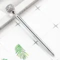Silver metal ballpoint pen with sparkling crystal gemstone topper and smooth rotating writing mechanism. - Electroplated Silver