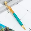 Bolígrafo de líquido con hoja de oro, cuerpo de metal turquesa y elegante diseño de escritorio. - Azul Pavo Real