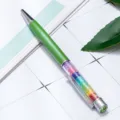 Green metal ballpoint pen with colorful sparkling crystals inside. Smooth writing office supply. - Green
