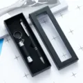 Black metal touch ballpoint pen and mini flashlight gift set in a sleek window box. - Black