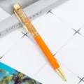 Penna a sfera liquida in foglia d'oro, elegante regalo di cancelleria in metallo arancione. - Arancione
