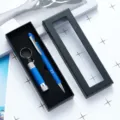 Blue ballpoint pen and mini flashlight gift set in elegant black box for corporate promotion. - Blue