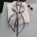 Elegant polka dot silk scarf detail, versatile narrow neck ribbon or stylish hair accessory. - Style 28