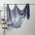 Detailed view of the blue tie-dye modal scarf hanging on a rack, showing soft fabric texture. - Ink Wash #10