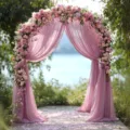 Outdoor wedding arch decoration with pink floral and elegant chiffon drapes for romantic ceremonies. - Dusty Pink