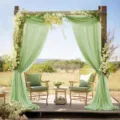 Outdoor wedding arch draping fabric set with elegant green sheer curtains for event decoration. - Green