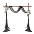 Wedding arch backdrop decoration with black chiffon sheer fabric drape and pink floral arrangements. - Black