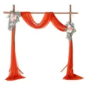 Wedding arch drape with orange chiffon fabric and pink floral decor for outdoor lawn events. - Rust Red No. 74