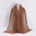 Details of the brown pleated scarf showing the exquisite crinkle texture and elegant drape. - 15# Dark Camel