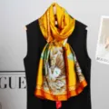 Elegant luxury yellow silk scarf with large floral print and chic orange border for women. - Style 4