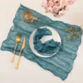 Close-up detail of textured teal cheesecloth table runner, perfect for wedding party decor. - 50*50cm Napkin / Malachite green