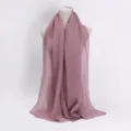 Detailed view of the pleated shimmer hijab scarf, featuring soft fabric texture and fine glitter. - Dusty Pink