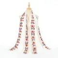 Detailed view of white cotton linen floral embroidered ethnic shawl scarf for travel. - Two-Row Embroidery White