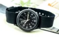 Montre homme en nylon noir avec cadran clair et aiguilles lumineuses pour le sport en plein air. - Noir