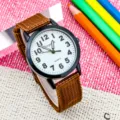 Kids quartz watch with brown nylon strap, clear numbers white dial, simple daily wear. - Brown and White