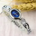 Women oval dial quartz watch, vintage minimalist silver bracelet watch with heart charm. - Fashion / Silver & Dark Blue
