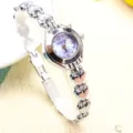 Montre quartz argentée pour femme avec bracelet à maillons cœur ajouré et cadran violet. - Style classique - argent bleu clair
