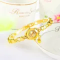 Montre quartz femme dorée avec bracelet cœur ajouré, pendentif élégant et cadran chic. - Style ajouré - Tout or - Cadran à chiffres complets