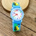 Kids cartoon quartz watch with blue silicone strap and colorful numbers for boys daily wear. - Excavator Style / Light Blue