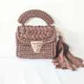 Handmade metallic ribbon crochet shoulder bag with top handle and tassel decoration. - Coffee