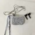 Silver handmade woven earphone bag with metal chain, heart pendant and stylish fringe tassel. - Silver