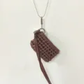 Handmade crochet mini pouch necklace with brown tassel and metal chain, chic accessory. - Reddish Brown
