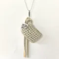 Handmade crochet mini earphone bag necklace with heart charm and stylish tassel accessory. - Light gold