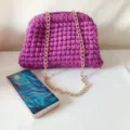 Handmade crochet shoulder bag in vibrant purple with elegant gold chain strap for women. - Purple with Chain