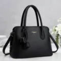 Black textured leather handbag with top handles and tassel, stylish women shoulder bag. - L 31cm, W 14cm, H 22cm, Handle 17cm / Black