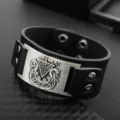 Detailed close-up of retro Nordic Viking style wide black PU leather cuff bracelet with alloy plaque. - Antique Silver