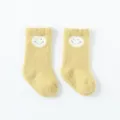 Calzini da neonato gialli spessi con faccina sorridente, materiale morbido per bimbi. - Taglia XS 0-6 Mesi / Faccina gialla