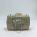 Sac pochette de soirée pailleté doré avec filet de strass et chaîne élégante. - Or