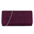 Detailed view of the sparkling purple glitter clutch bag with silver chain strap for evening party. - Fuschia