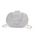 Sac pochette de soirée tissé argenté avec bandoulière chaîne et fermoir strass scintillant. - Argent