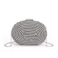 Black and white woven clutch bag with elegant silver chain strap and sparkling rhinestone clasp. - Black and White
