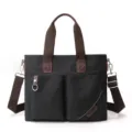 Schwarze Segeltuchtasche mit braunen Griffen, vielseitige Umhaengetasche fuer den Alltag. - Horizontal / Horizontal Schwarz