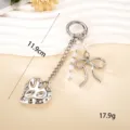 High-end silver bow and heart charm keychain with white pearls for women bag decoration - Crater Heart Charm