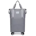 Grey foldable travel duffel bag with universal wheels, large capacity expandable luggage. - Gray