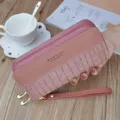 Pink crocodile texture double zipper long wallet for women with wrist strap, stylish design. - Taro