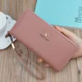 Women's pink long zipper wallet wristlet purse with stylish maple leaf accent and spacious interior. - Long Clutch / Pink
