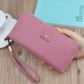 Pink long zip wallet with wrist strap and stylish leaf logo, premium lychee texture design. - Long Clutch / Bean Paste Red