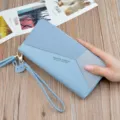 Women's long wallet color block PU leather zipper purse with tassel wrist strap and cute rabbit pendant. - Blue