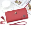 Red long wallet for women with zipper, tassel and cute bunny charm, stylish PU leather clutch. - Jujube Red