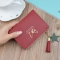 Red short women wallet with cute butterfly metal decor tassel and star pendant zipper. - Wine Red