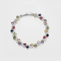Close-up detail of luxury multi-color cubic zirconia cross tennis bracelet for women fashion. - Silver and Colored