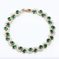 Elegant gold plated cross-curve green zirconia crystal bracelet for women fashion jewelry. - Gold and Green