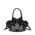 Borsa a mano gotica punk con teschio, stampa lapide e borchie metalliche eleganti. - Nero