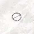 Detailed close-up of the silver metal irregular round scarf ring and clothing corner buckle. - Gun Black