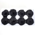 Detailed shot of black preserved rose heads in a white tray, perfect for DIY crafts. - Black