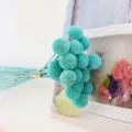 Close up view of teal preserved billy ball dried flowers bouquet detail for creative decor. - 20 Stems per Bunch / Blue